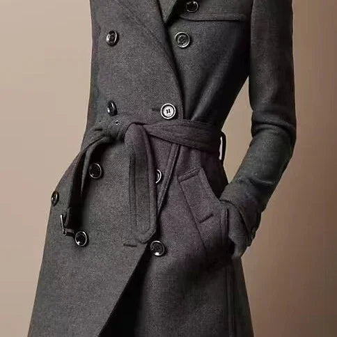 close-up of stylish dark gray double-breasted wool coat with belt and pockets