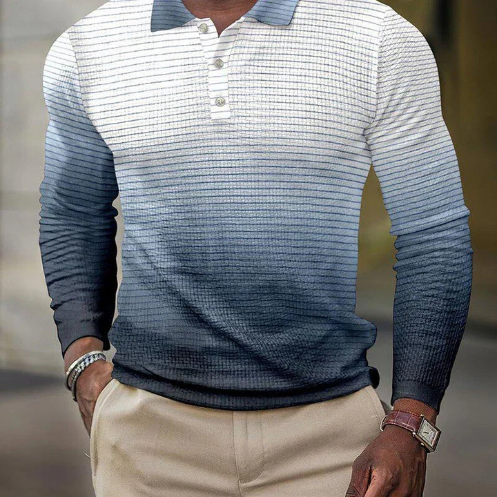 Man wearing a long-sleeve white and blue striped polo shirt with beige pants and accessories