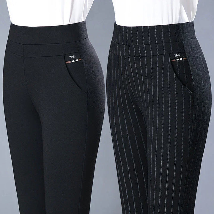 Close-up of women's black fitted pants, one plain and one pinstriped, with front pockets and white tops