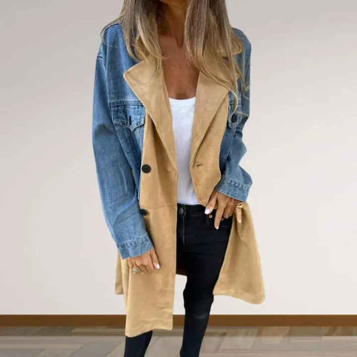Woman wearing a stylish two-tone denim and camel suede coat with black pants and white top