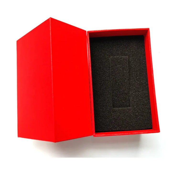Open red gift box with black foam insert on white background