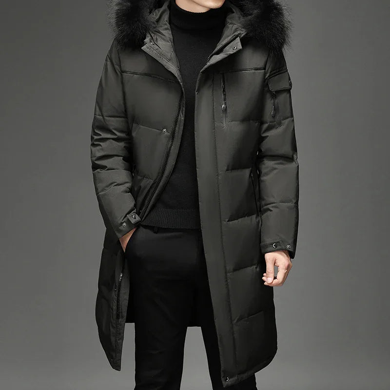 Men's black long padded winter coat with fur hood and zippered pockets, styled over black turtleneck