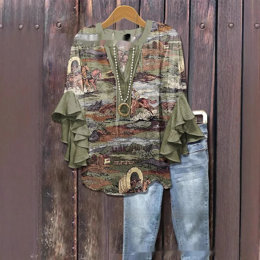 Boho style ruffle sleeve blouse with western scene print paired with light wash denim jeans on wooden background