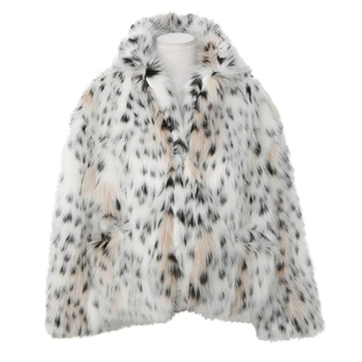 white and beige spotted faux fur coat with black irregular spots on mannequin