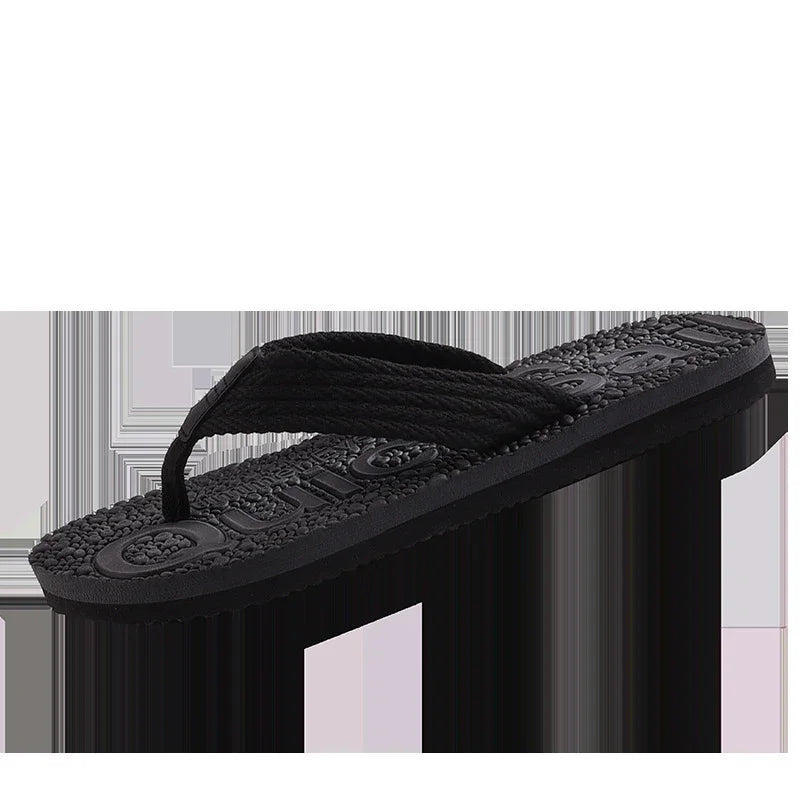 black cushioned flip flop sandal with textured sole and fabric strap