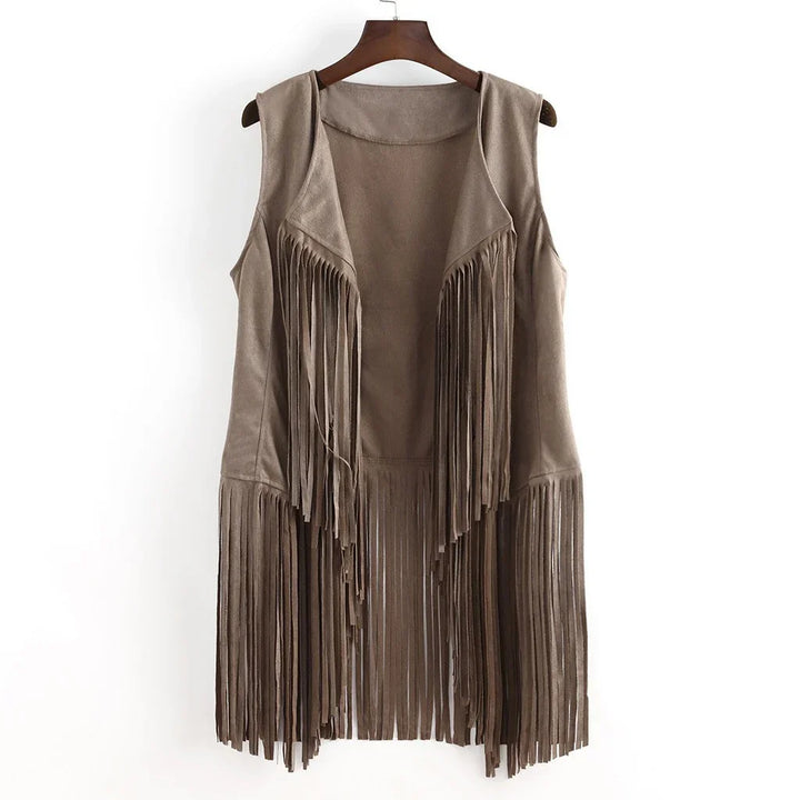 Brown faux suede sleeveless vest with long fringe details hanging on wooden hanger
