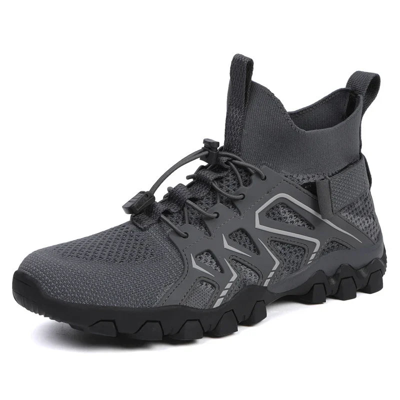 gray high-top athletic shoe with mesh upper, tactical outsole, and elastic lace fastening