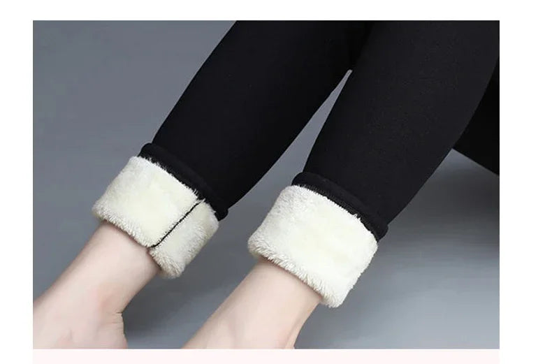 close-up of legs wearing black fleece-lined leggings with white fur cuffs