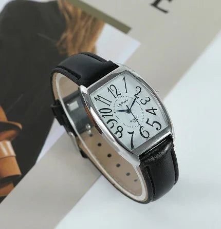 Stylish wristwatch with black leather strap and silver rectangular case featuring large stylized numerals