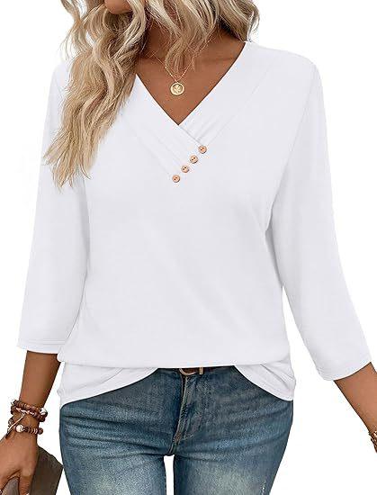 Woman wearing white V-neck long sleeve blouse with wooden buttons and blue jeans