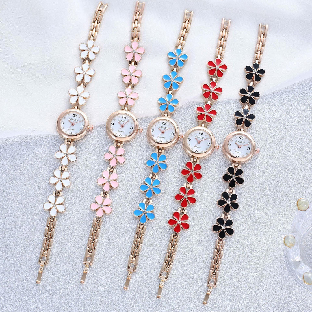 Set of five flower-themed bracelets watches in white, pink, blue, red, and black on silver and white background