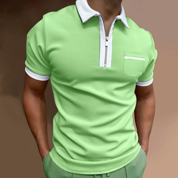 Man wearing light green short-sleeve polo shirt with white collar, zipper, and pocket trim