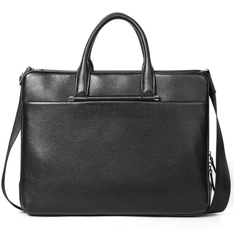 Black leather briefcase with dual handles and adjustable shoulder strap, textured surface
