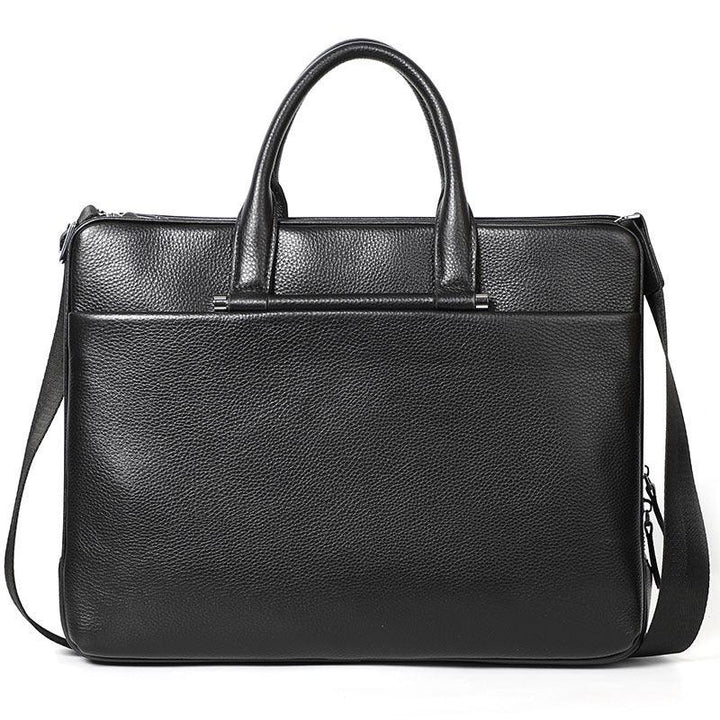 Black leather briefcase with dual handles and adjustable shoulder strap, textured surface