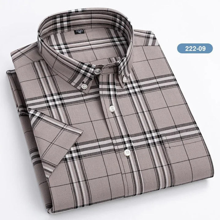 Folded short-sleeve button-down plaid shirt in brown and black tones
