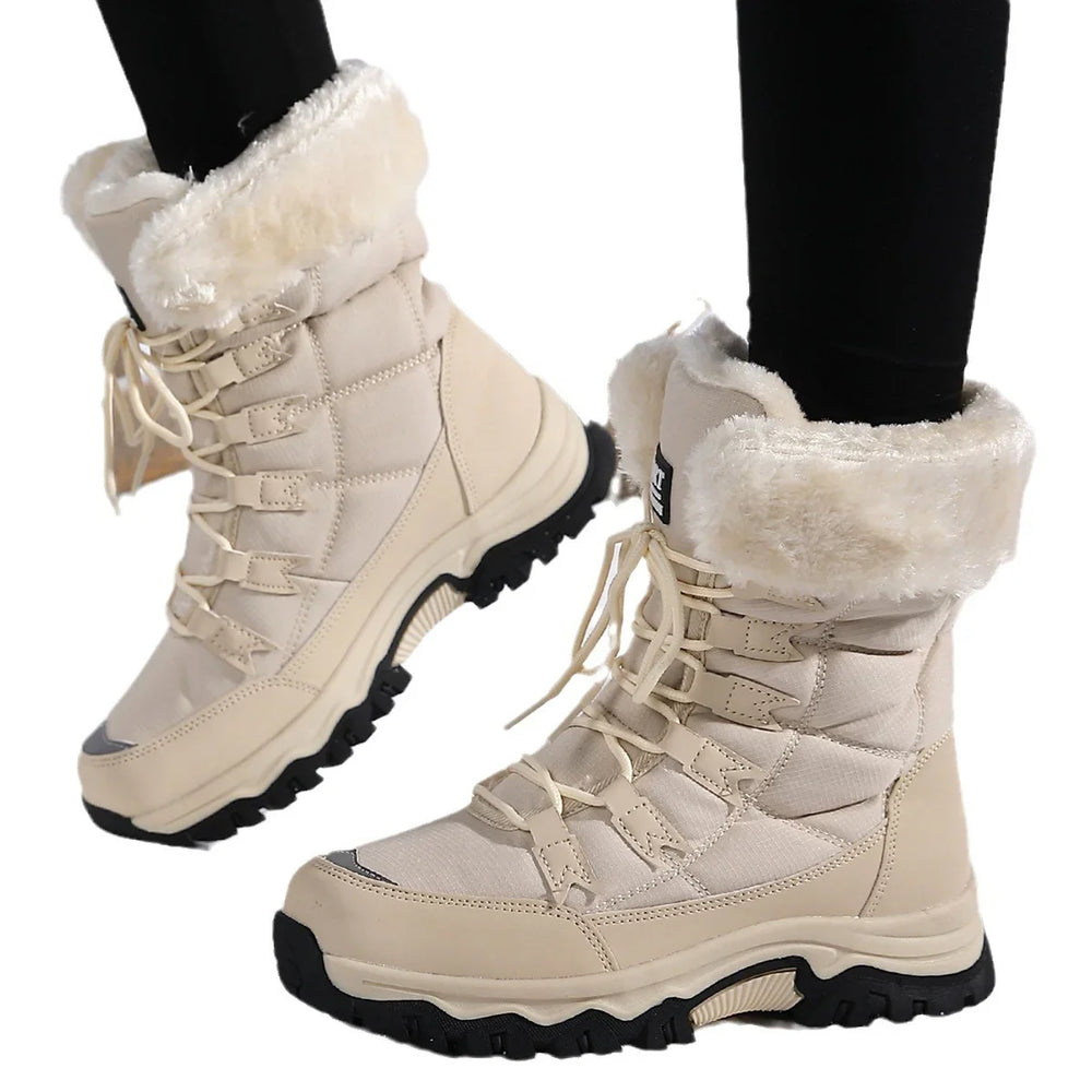 Beige winter boots with faux fur cuffs and thick black soles worn with black leggings