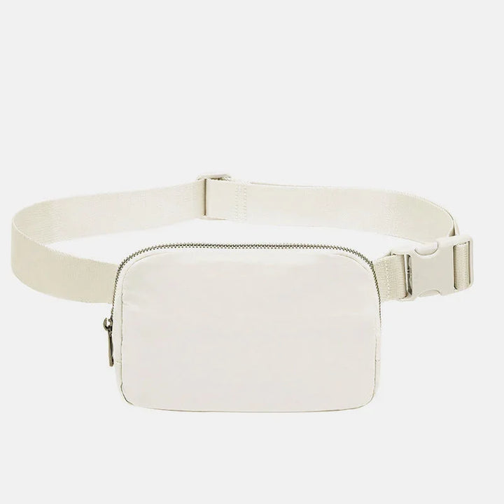 Minimalist beige rectangular waist bag with adjustable strap and zipper closure on white background