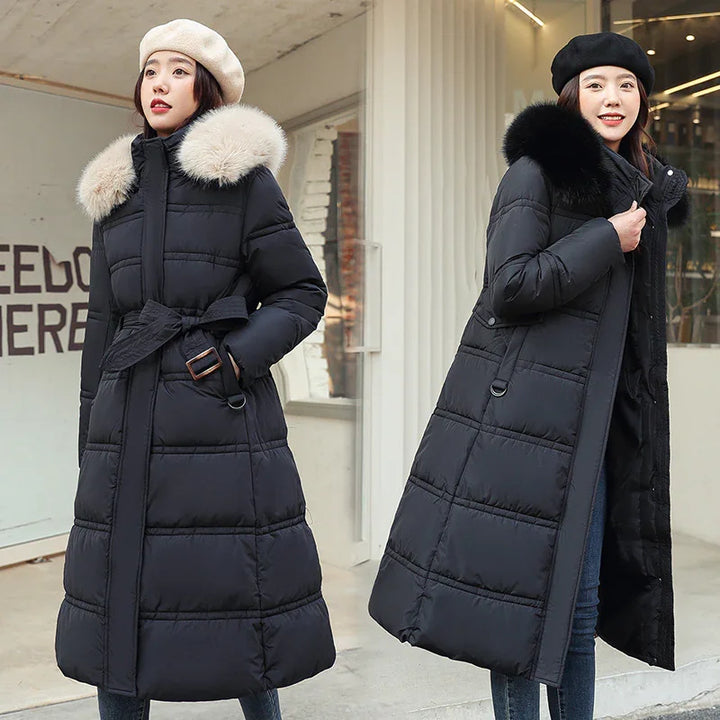 Women wearing long black padded winter coats with fur collars, styled with berets, outdoors