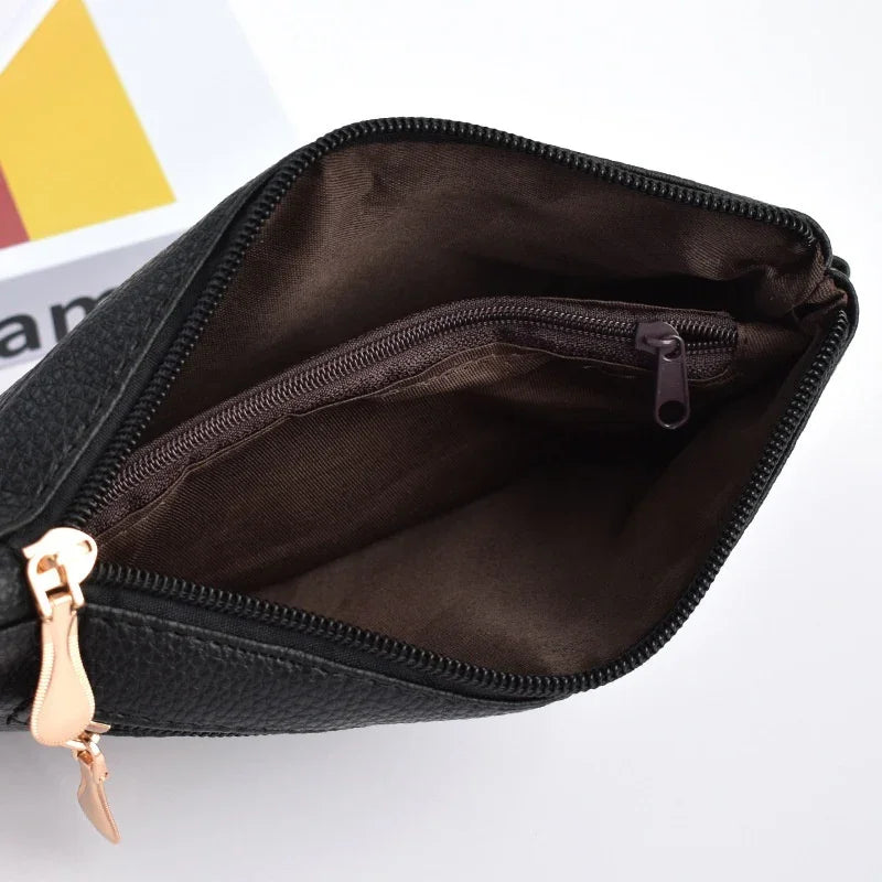 Black leather makeup bag with rose gold zipper and inner zip pocket, brown fabric lining