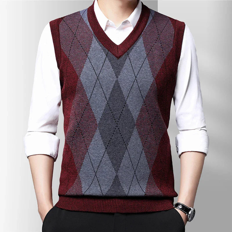 Men's sleeveless V-neck argyle sweater vest in burgundy, gray, and black over white shirt