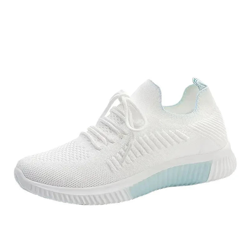 White breathable knit athletic sneaker with cushioned sole and lace-up design