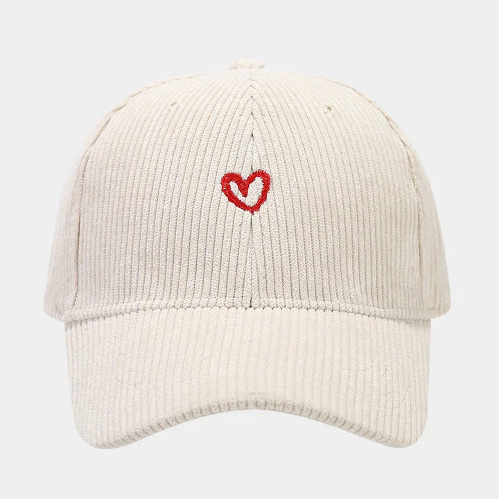 Beige corduroy baseball cap with small red embroidered heart on front