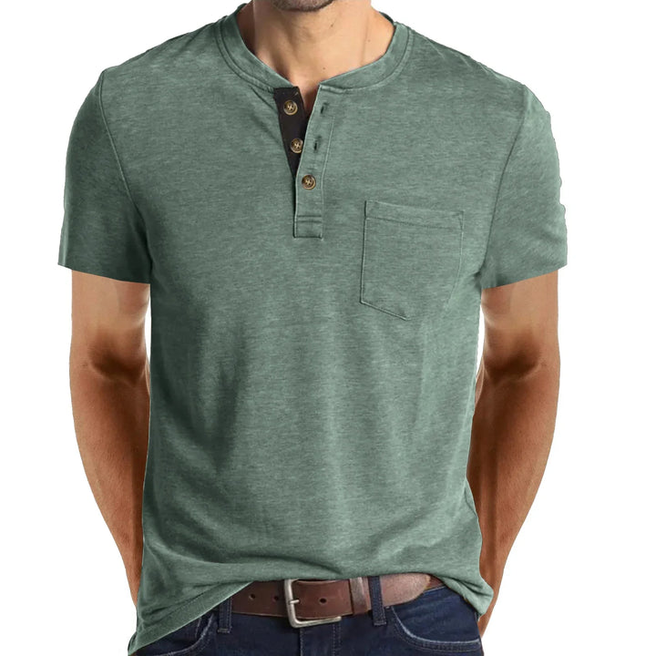 Man wearing green short-sleeve henley t-shirt with chest pocket and button-up collar