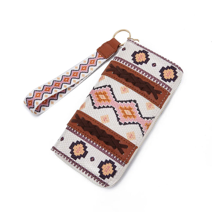 Bohemian-style wristlet wallet with geometric southwestern patterns and leather braided details