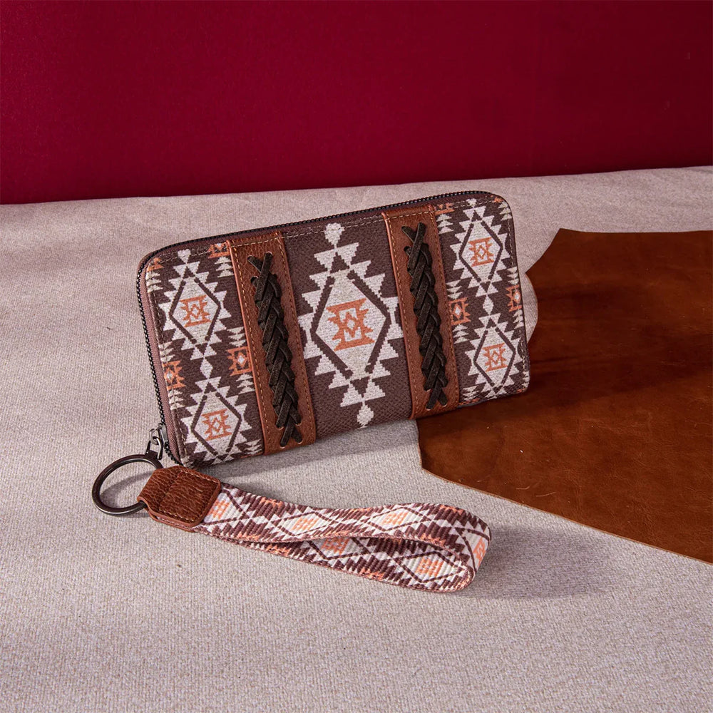 Brown and beige tribal patterned wallet with braided leather details and a matching wrist strap