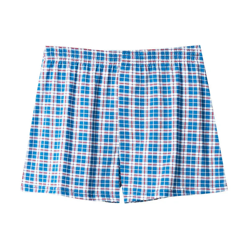 Blue, white, and red plaid cotton men's boxer shorts with elastic waistband on white background