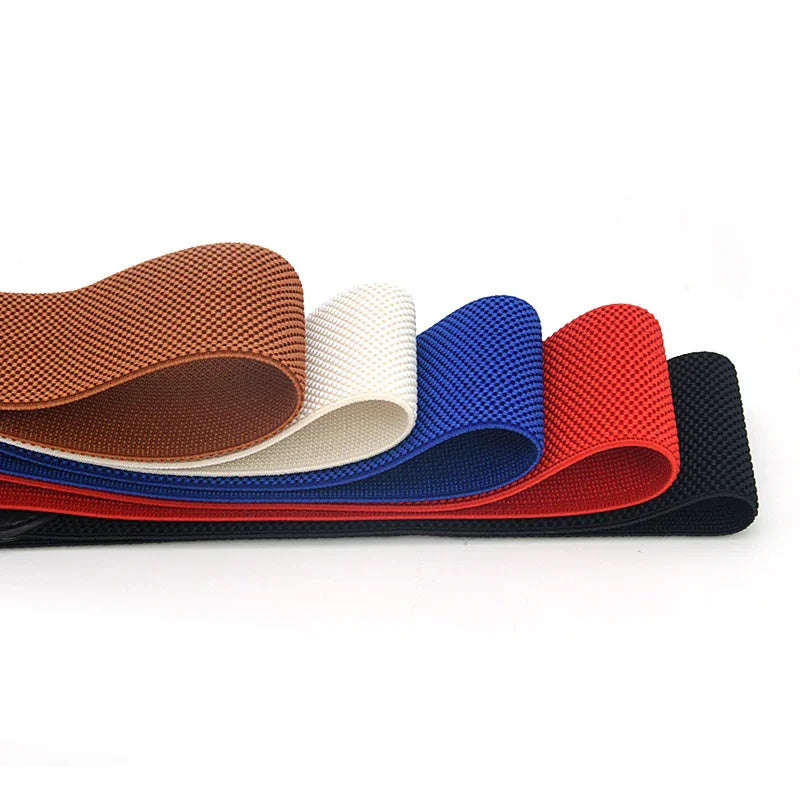 Stack of textured nylon fabrics in brown, white, blue, red, and black colors on white background