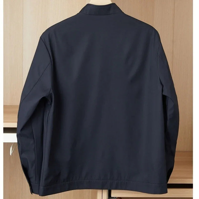 Navy blue casual jacket hanging on a wooden shelf background