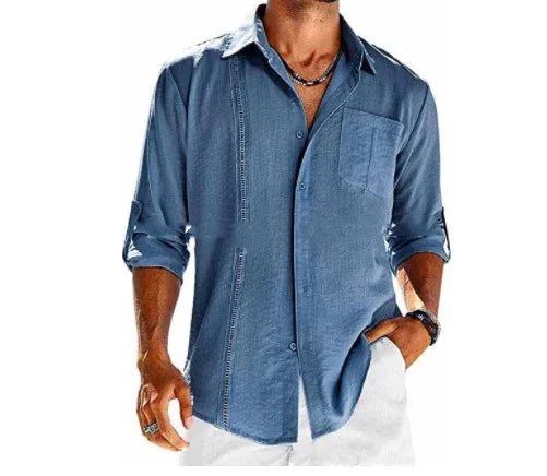 Men's long sleeve blue casual button-up shirt with rolled sleeves and chest pocket