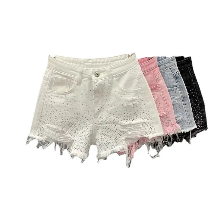 Set of distressed denim shorts in white, pink, gray, and black with stud detailing and frayed hems