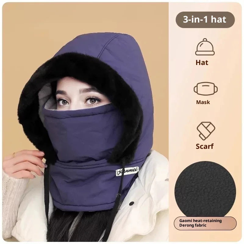 Woman wearing a purple 3-in-1 winter hat with mask and scarf combination, faux fur trim hood