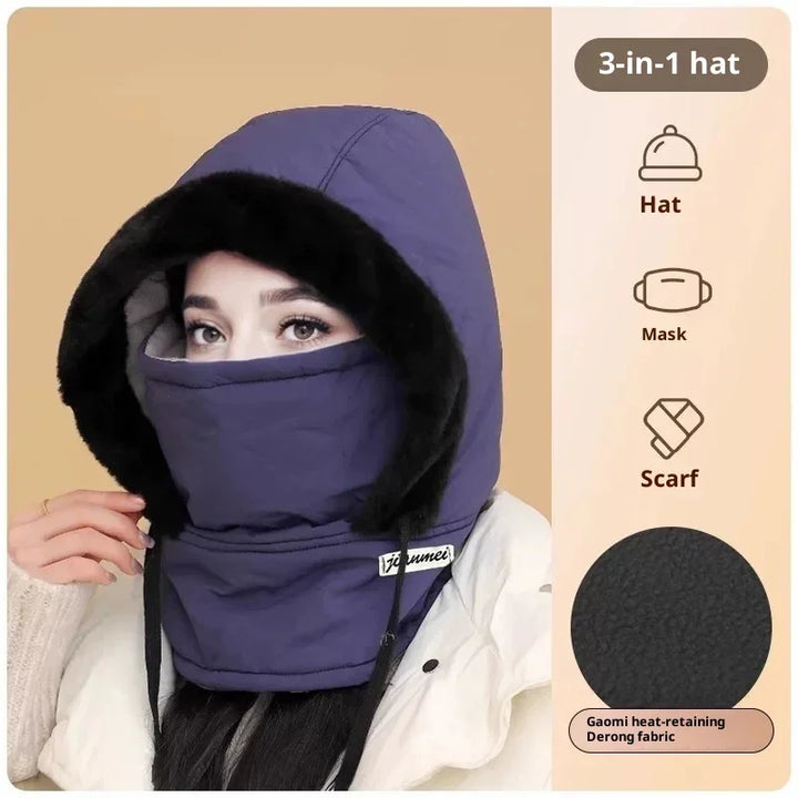 Woman wearing a purple 3-in-1 winter hat with mask and scarf combination, faux fur trim hood