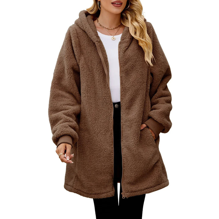 Woman wearing oversized brown hooded teddy fleece zip-up jacket with pockets