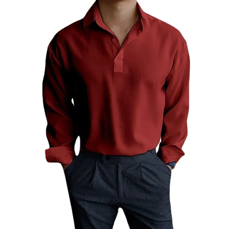 Man wearing a long-sleeve red polo shirt with button-less collar and dark gray pants