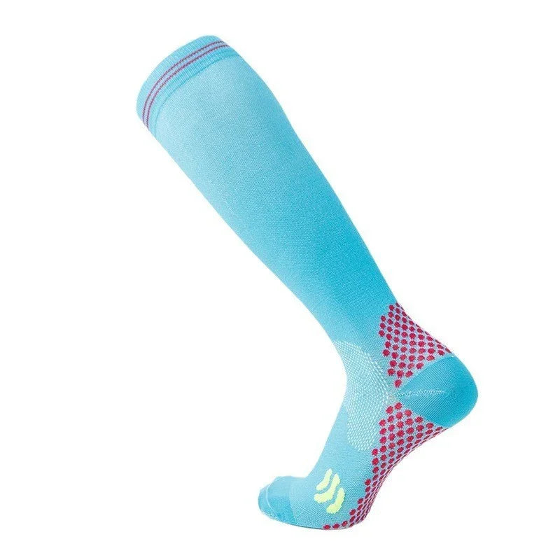 Light blue knee-high compression sock with pink grip dots on sole and ankle support