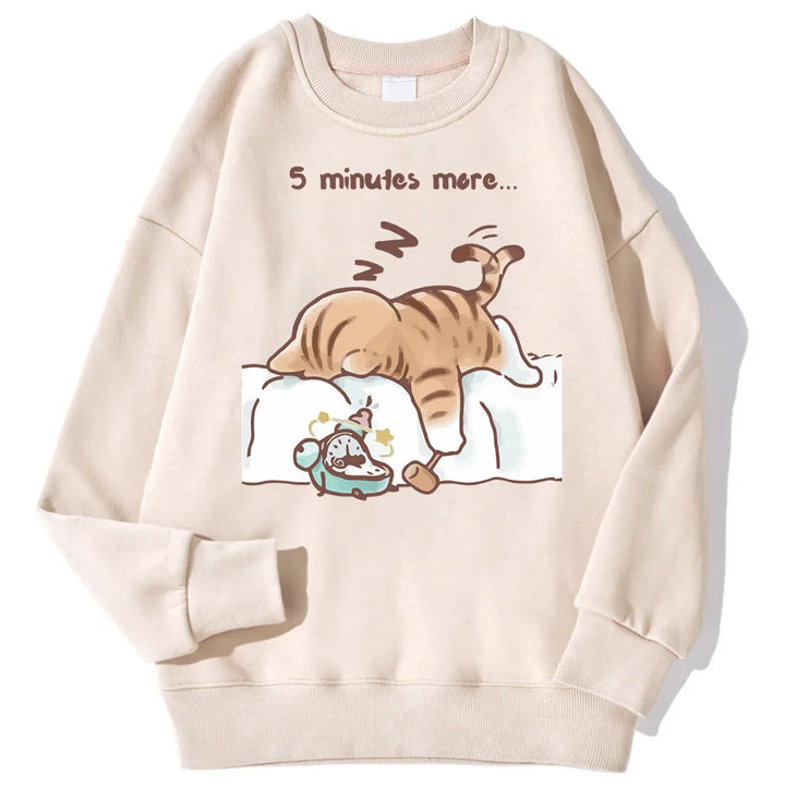 Beige sweatshirt with cute illustration of a sleeping striped cat and alarm clock, text '5 minutes more'