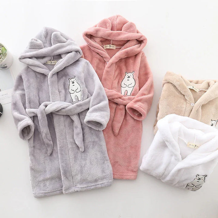Soft plush children's hooded robes in gray, pink, beige, and white with bear embroidery and belts