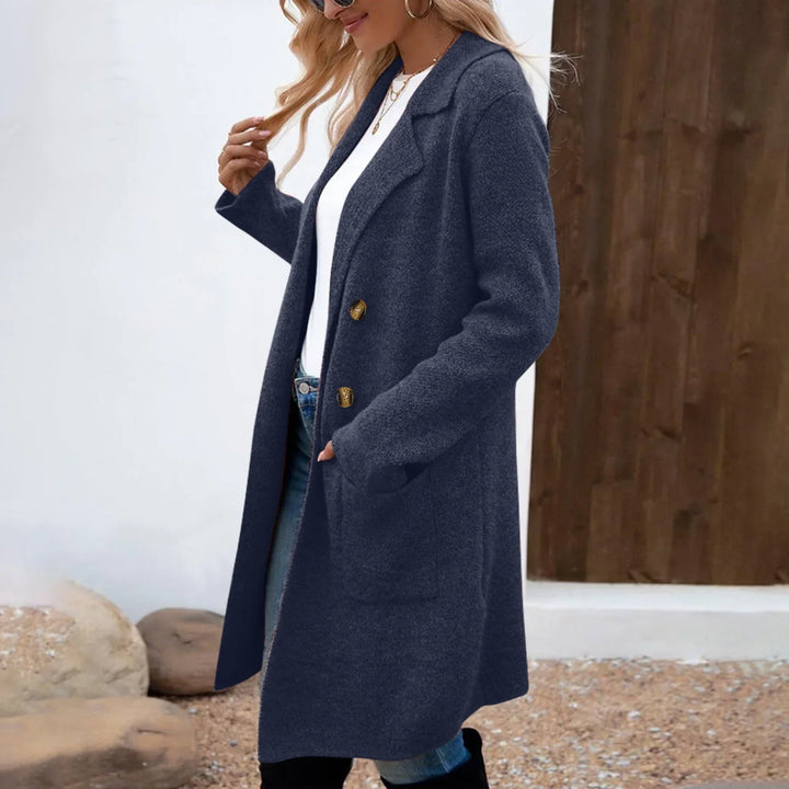 Woman wearing navy blue wool blend long coat with lapel collar and gold buttons outdoors