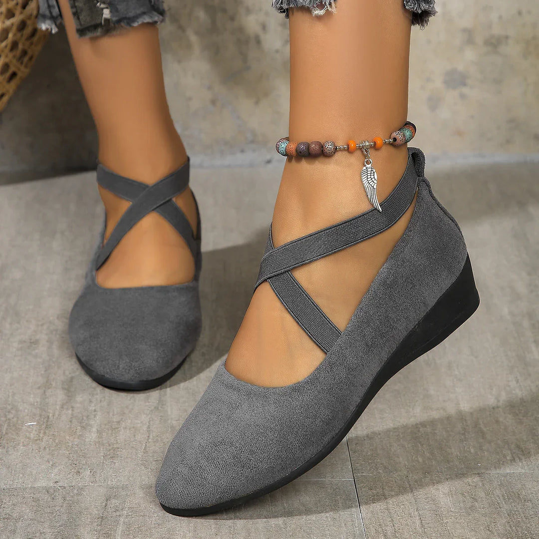 Women's gray suede wedge shoes with elastic cross straps and beaded anklet with wing charm