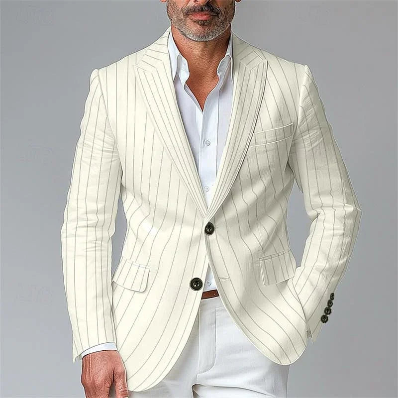 Man wearing a white pinstripe blazer with black buttons and a white shirt, half body shot