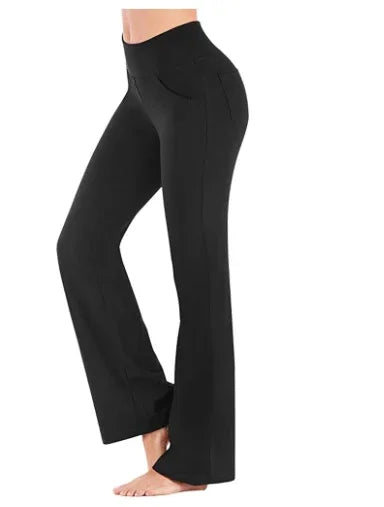 Woman wearing black high-waisted flare yoga pants with side pockets, barefoot