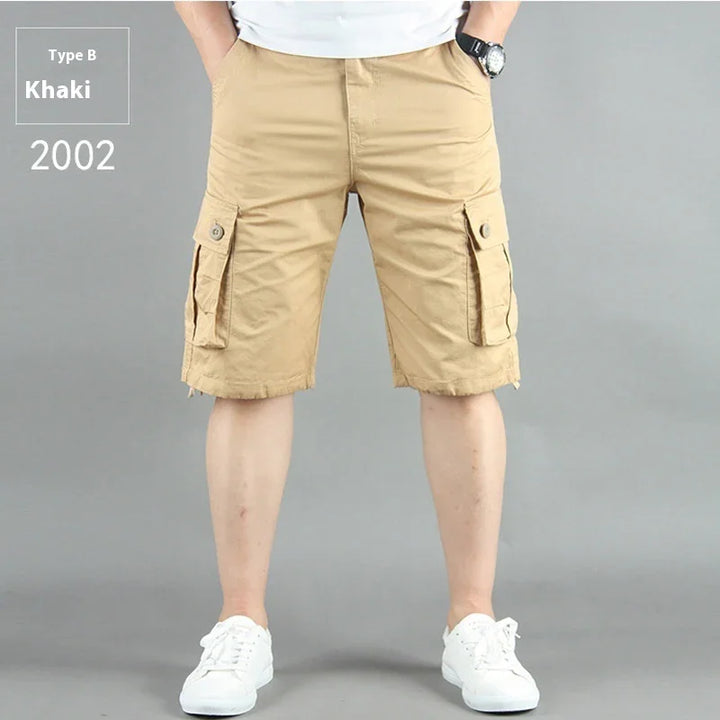 Men's khaki cargo shorts Type B 2002 with buttoned side pockets, worn with white sneakers