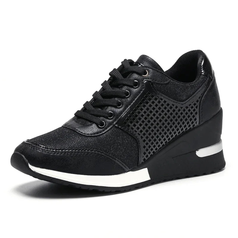 black women's wedge sneaker with mesh side panels and white sole detail