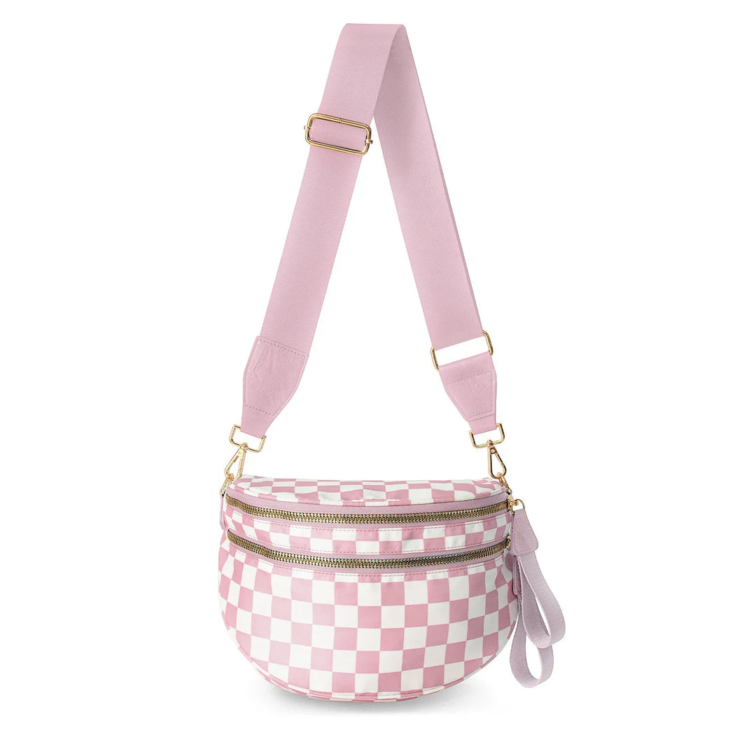 Pink and white checkered crossbody bag with double gold zippers and wide adjustable strap