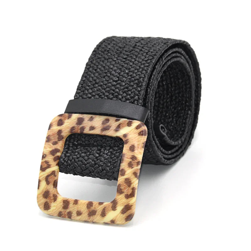 Black woven belt with square leopard print buckle on white background
