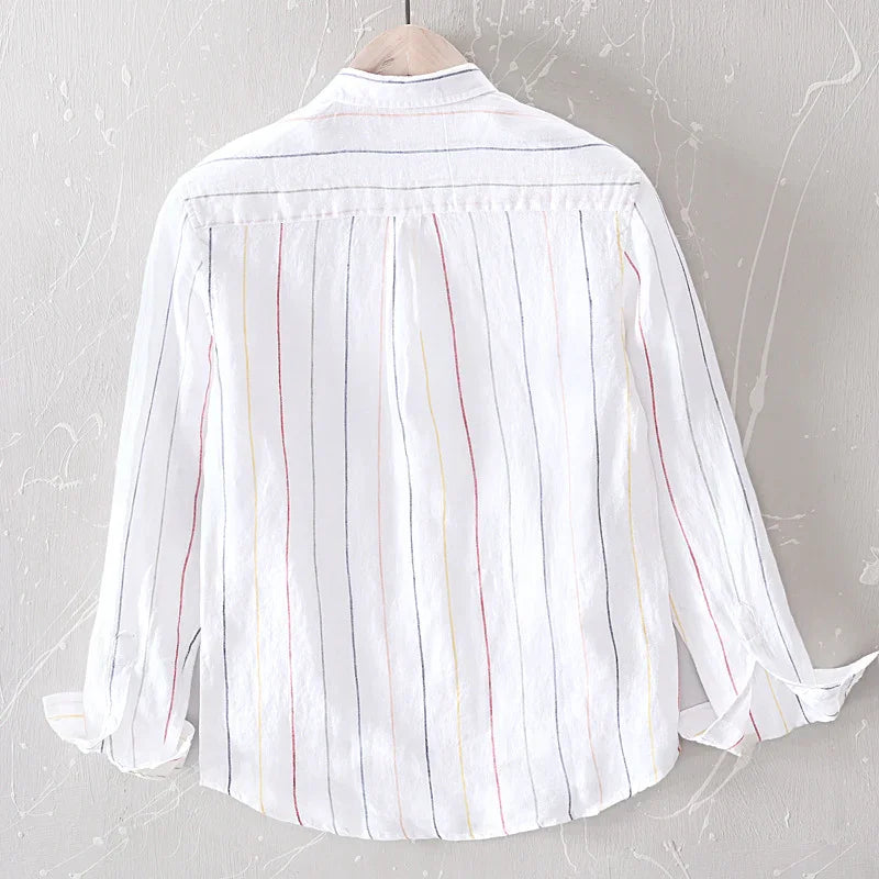 Back view of white long-sleeve shirt with red, yellow, and navy vertical stripes on hanger